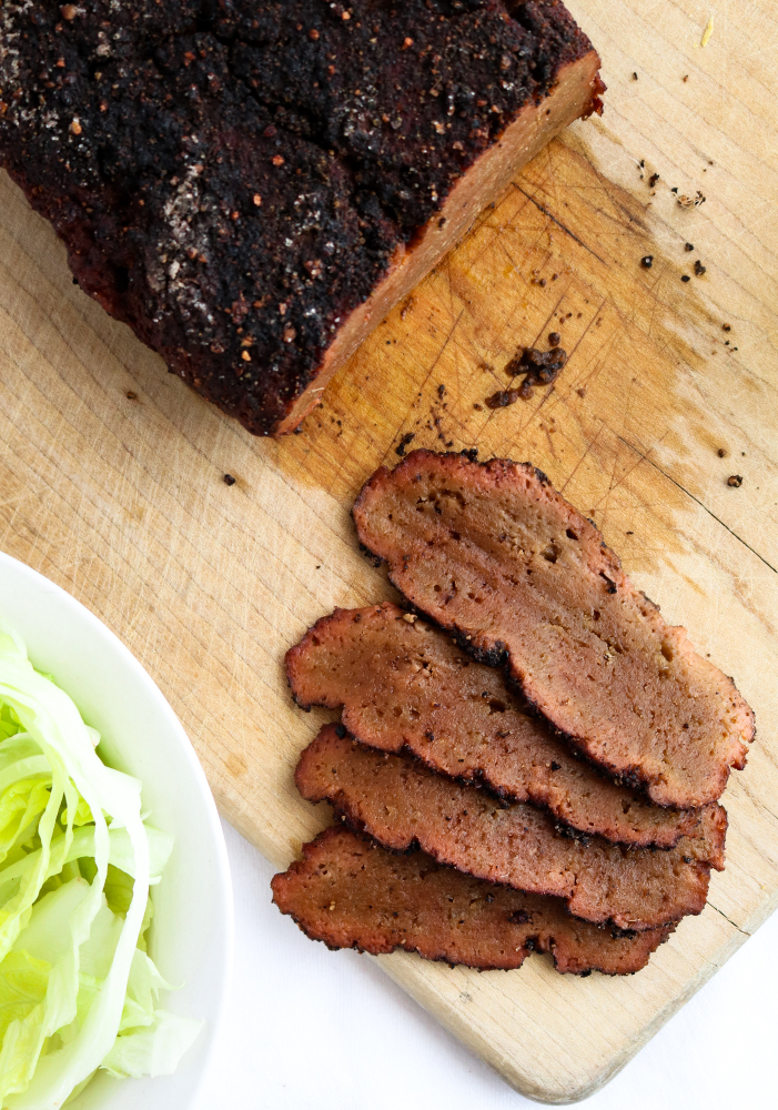 Vegan Corned Beef that is as meaty and flavorful as any non-vegan version we've ever had but made from seitan in the slow-cooker! The gorgeous color comes from beet puree, a much healthier alternative that still kicks ass. #vegan #seitan #plantbased #crockpot // plantpowercouple.com